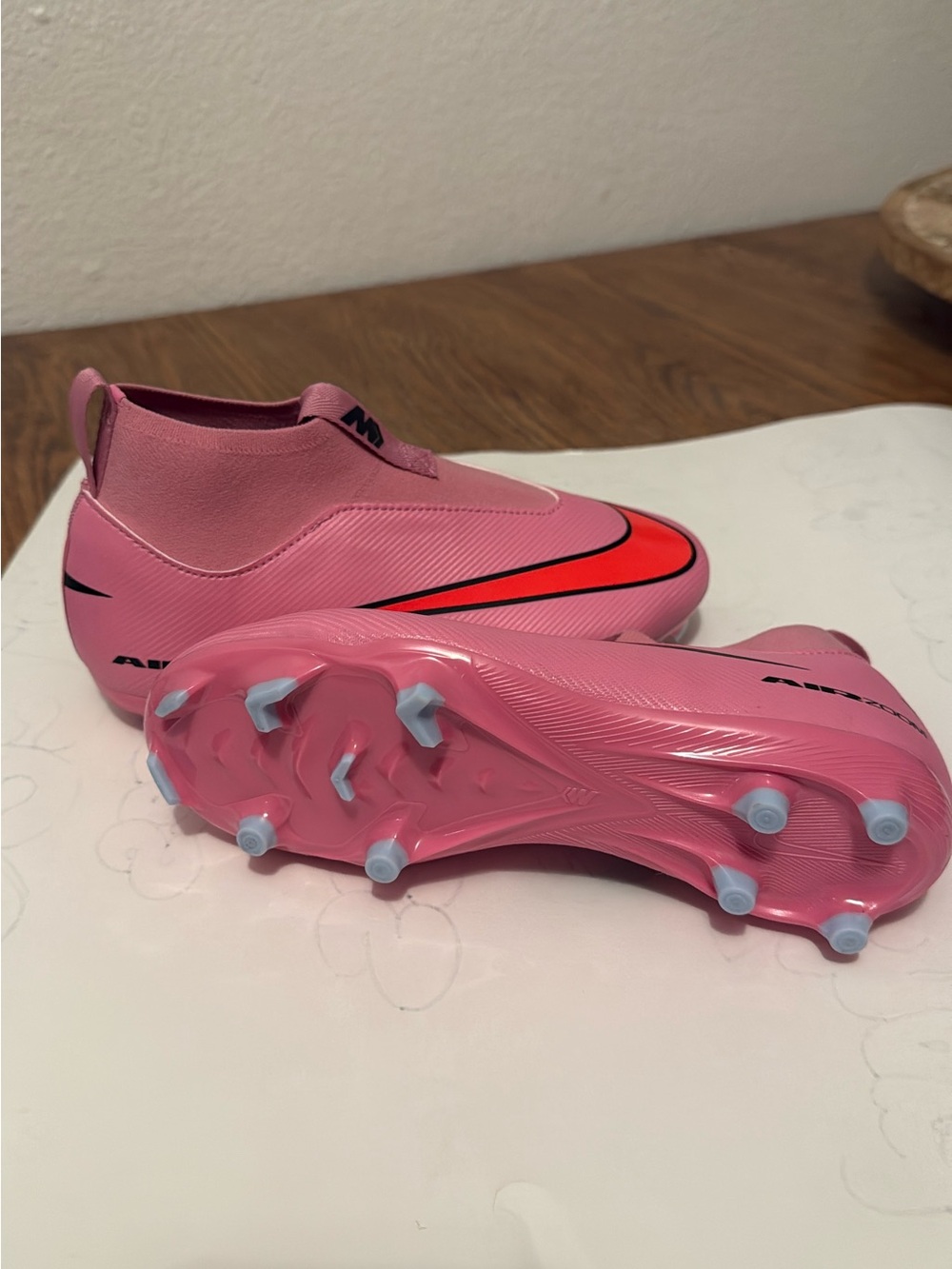 Nike Kids Pink Soccer Cleats with Red Swoosh